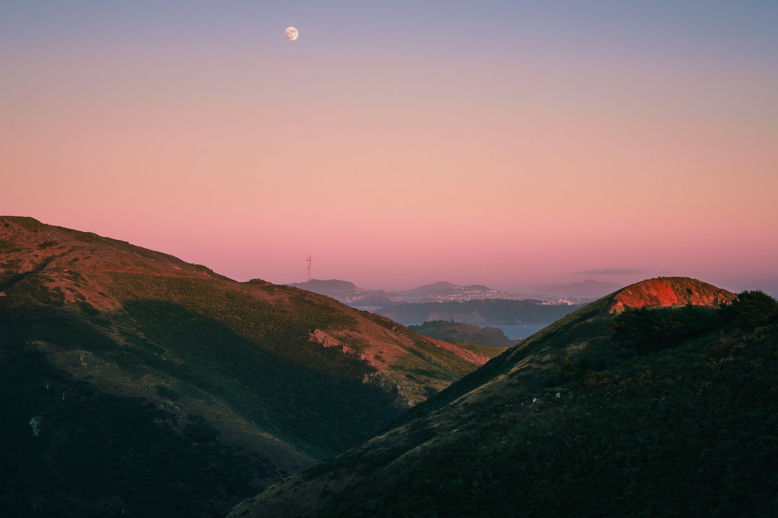 Moonrise over the Marin Headlands ridgelines at dusk