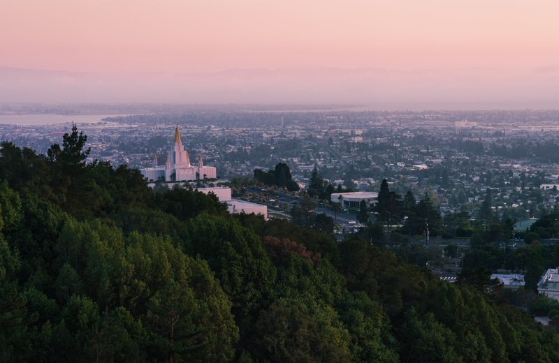 Oakland Temple at golden hour seen from the hills