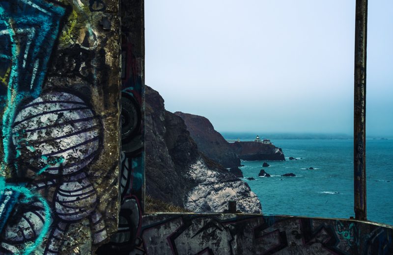 Point Bonita Lighthouse seen through a graffiti-covered bunker window