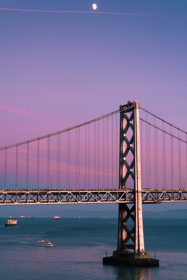 Bay Bridge tower at moonrise, pink dusk sky
